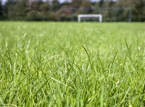 different shades of grass on football pitch